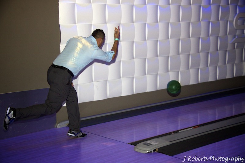man ten pin bowling - party photography